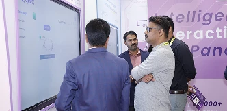 Small group of teachers exploring whiteboarding tools on COLTEC panel