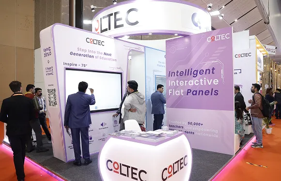 Close-up of demo zone inside COLTEC stall with teachers exploring panel