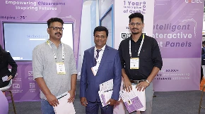 Networking conversation among partners at COLTEC booth