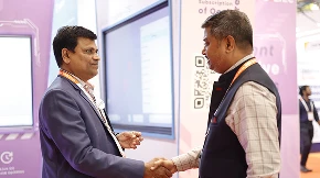 Close-up of partnership discussion around COLTEC and Qeeb solutions