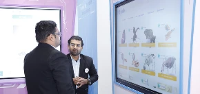 Teacher reviewing Qeeb analytics dashboard during demo