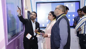 Group of decision-makers exploring Qeeb interface on COLTEC panel