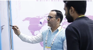 Group of decision-makers exploring Qeeb interface on COLTEC panel